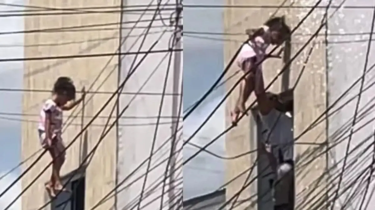 Vídeo: Criança cai de janela, fica pendurada em fiação elétrica e é resgatada por policial em AL Criança cai de janela, fica pendurada em fios elétricos e é resgatada por policial em AL (Foto: Reprodução/ g1)